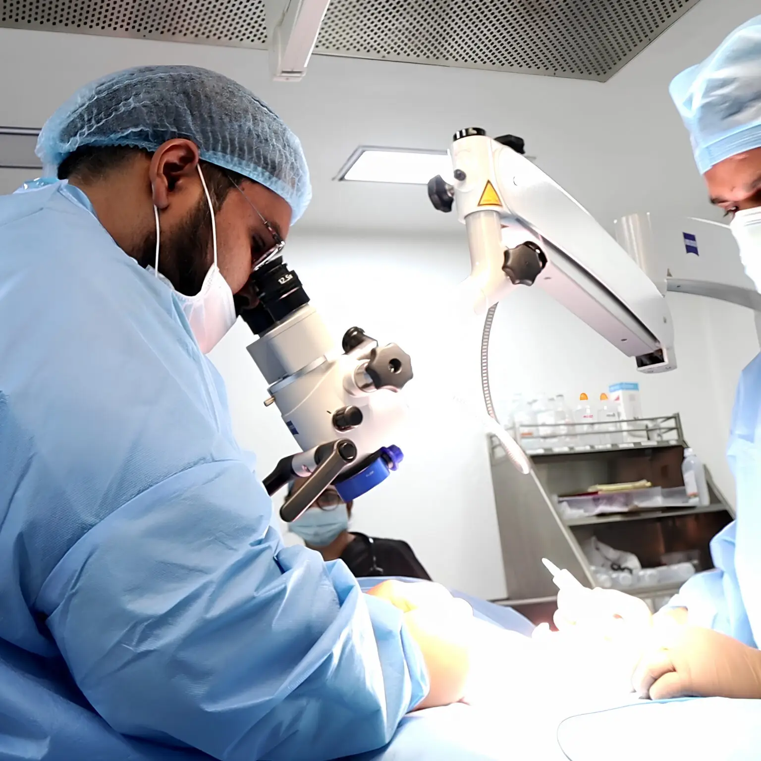 Doctor Vijayant using microscop during Varicocele Microsurgery